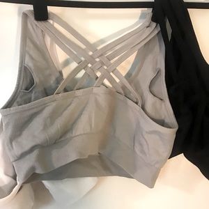 Set of three sports bras. Medium impact. Grey, white, and black.